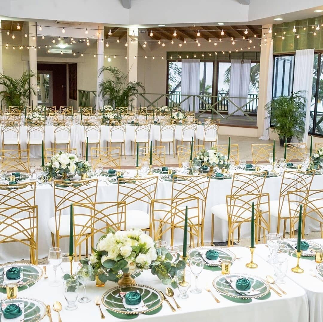 Tablescapes Tobago gold chairs set for a reception